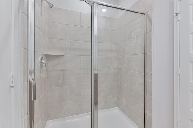 bathroom featuring an enclosed shower