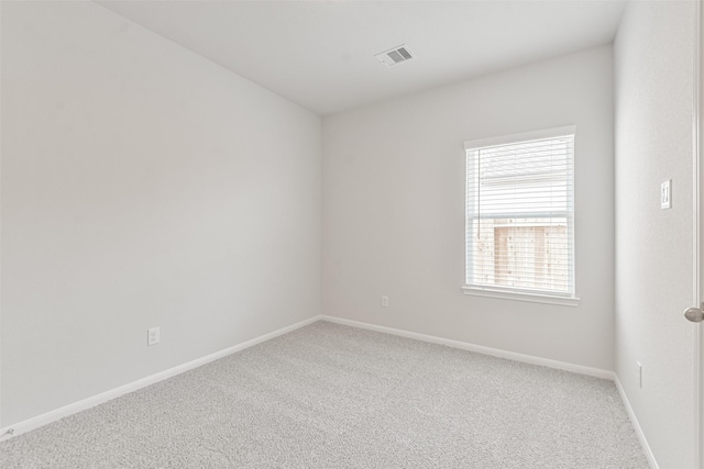 empty room with carpet flooring