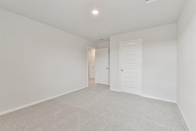 unfurnished bedroom with carpet and a closet