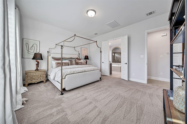 carpeted bedroom with ensuite bathroom