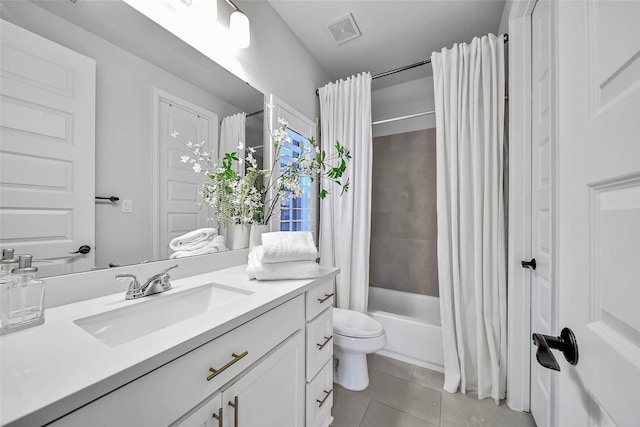 full bathroom with tile patterned floors, shower / bath combination with curtain, toilet, and vanity