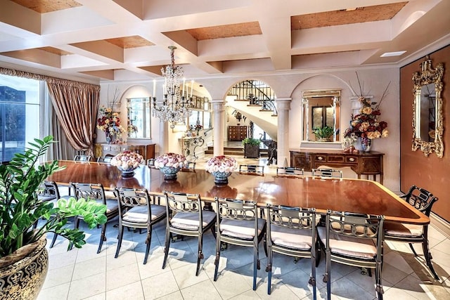 tiled dining room with ornate columns, plenty of natural light, and a chandelier