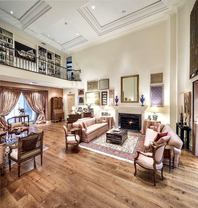 interior space featuring a high ceiling, coffered ceiling, crown molding, beamed ceiling, and wood-type flooring