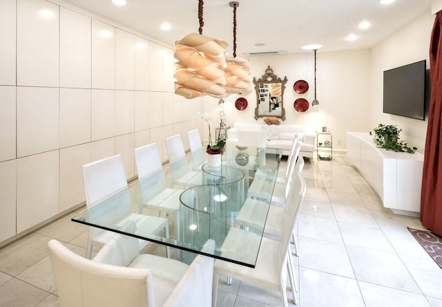 tiled dining area with tile walls