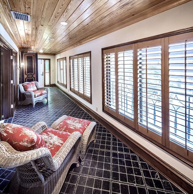 living area with wood ceiling