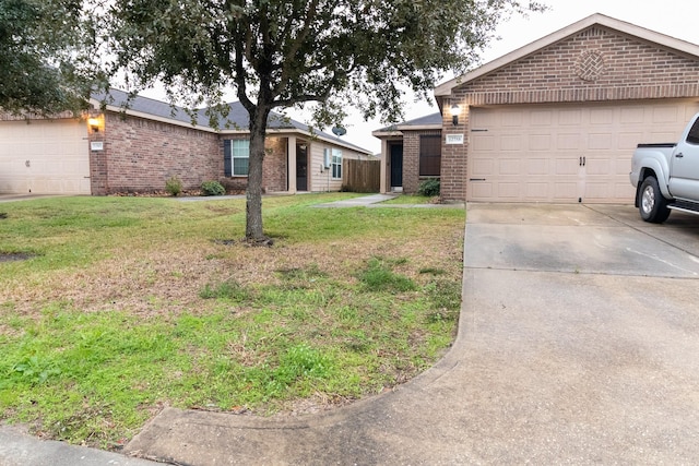 view of front of home with a garage and a front yard