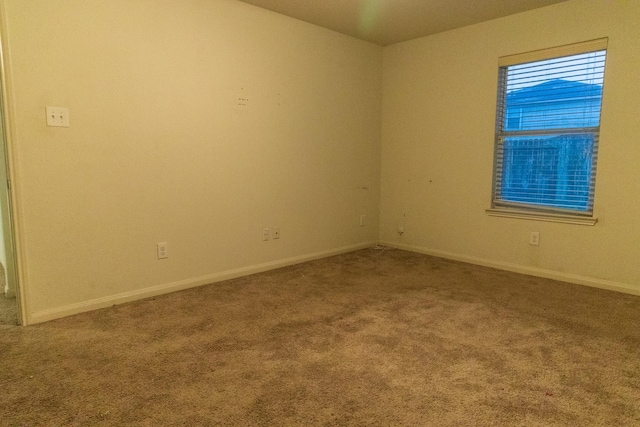 spare room featuring carpet flooring