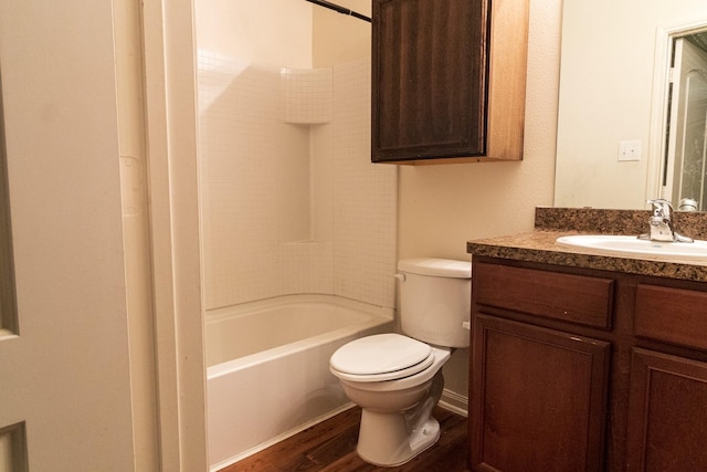 full bathroom with vanity, toilet, wood-type flooring, and tub / shower combination