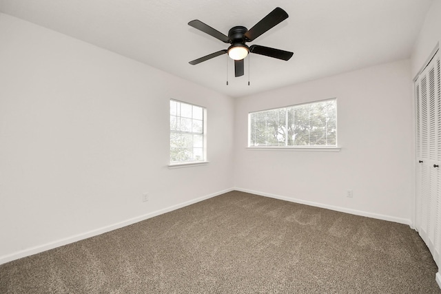 carpeted empty room with ceiling fan