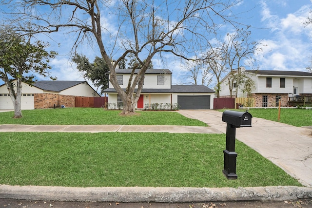 view of front of house with a garage and a front yard