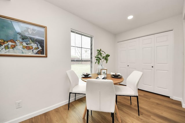 dining room with hardwood / wood-style flooring