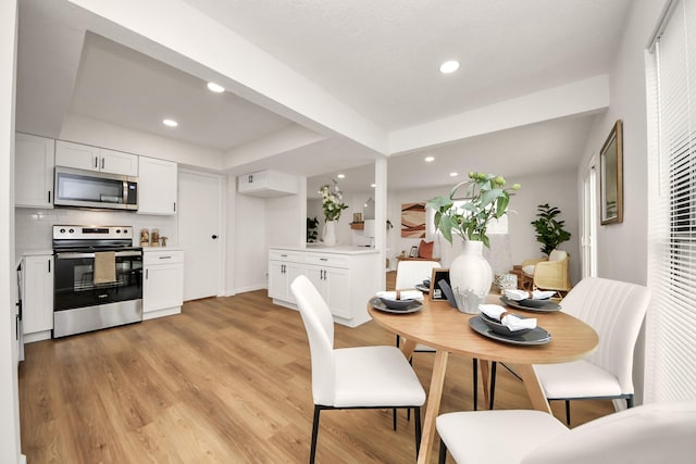 dining room with light wood-type flooring