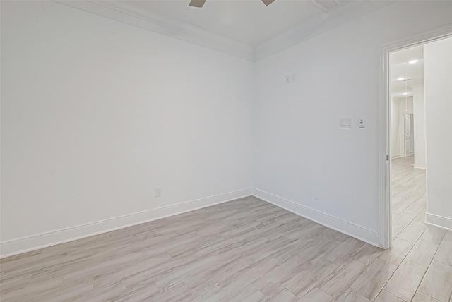 unfurnished room featuring ceiling fan and crown molding