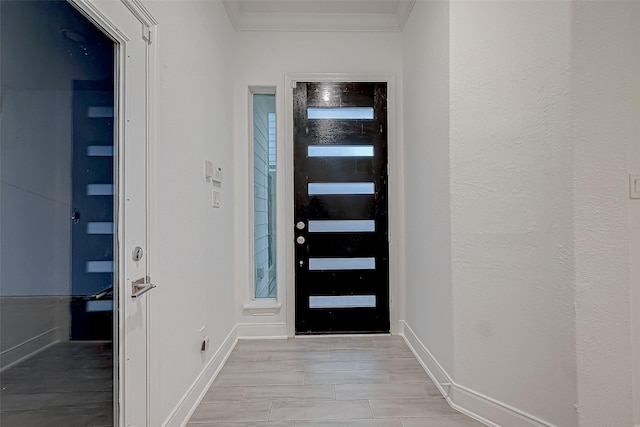 entrance foyer featuring ornamental molding