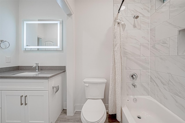 full bathroom featuring hardwood / wood-style flooring, toilet, vanity, and shower / bath combo