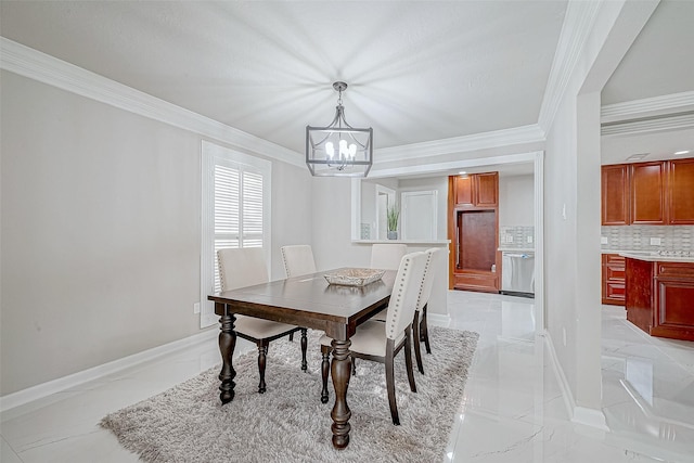 dining area featuring ornamental molding and a notable chandelier