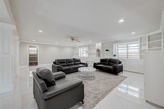 living room with ceiling fan, built in features, ornamental molding, and a wealth of natural light