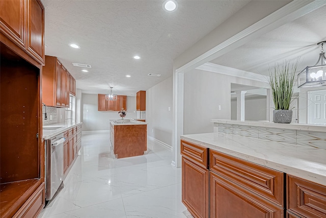 kitchen featuring light stone countertops, a textured ceiling, tasteful backsplash, and stainless steel dishwasher