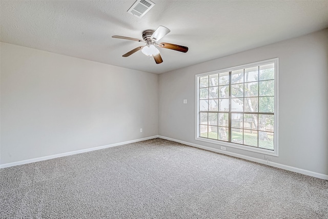 spare room with ceiling fan and carpet floors