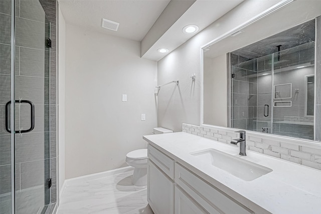 bathroom featuring an enclosed shower, vanity, toilet, and tasteful backsplash