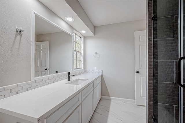 bathroom with vanity and backsplash