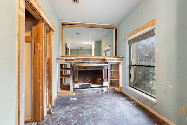 corridor with hardwood / wood-style floors