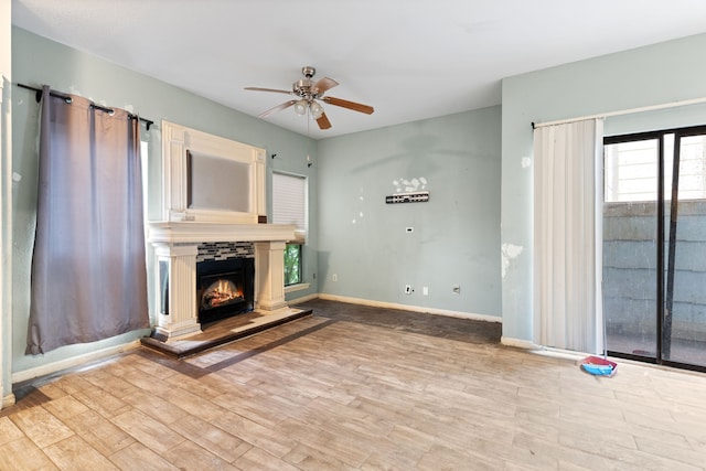 unfurnished living room with ceiling fan and light hardwood / wood-style floors