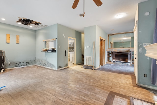 interior space with hardwood / wood-style flooring and ceiling fan