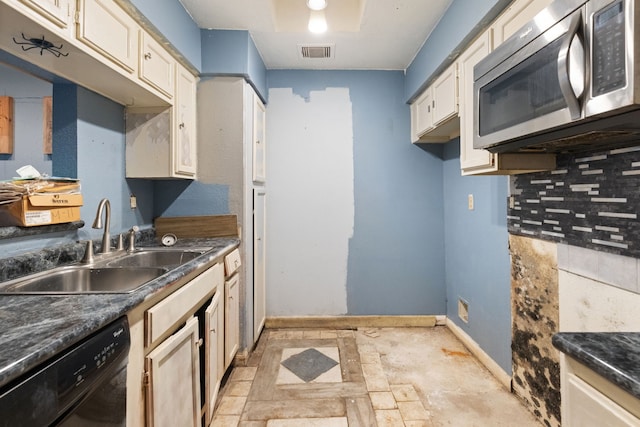 kitchen featuring dishwasher, sink, and backsplash