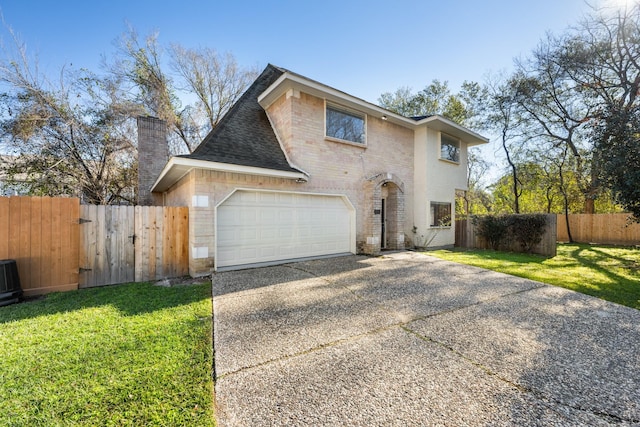 view of front facade featuring a garage and a front yard