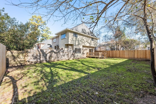 view of yard with a wooden deck