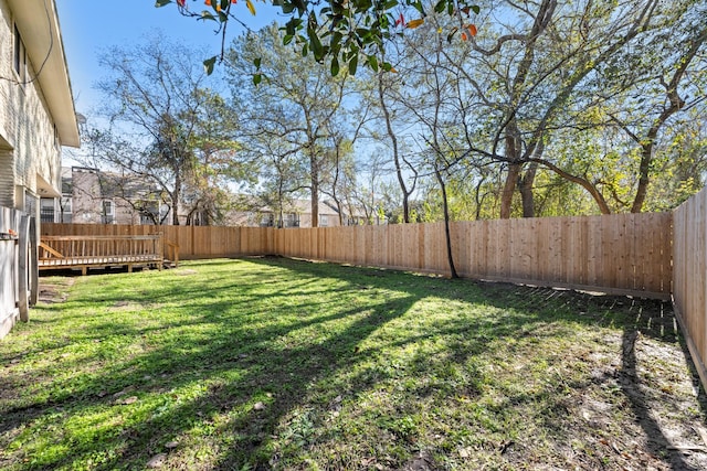 view of yard with a wooden deck