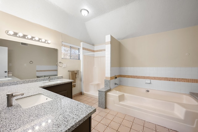 bathroom featuring vanity, separate shower and tub, lofted ceiling, and a textured ceiling