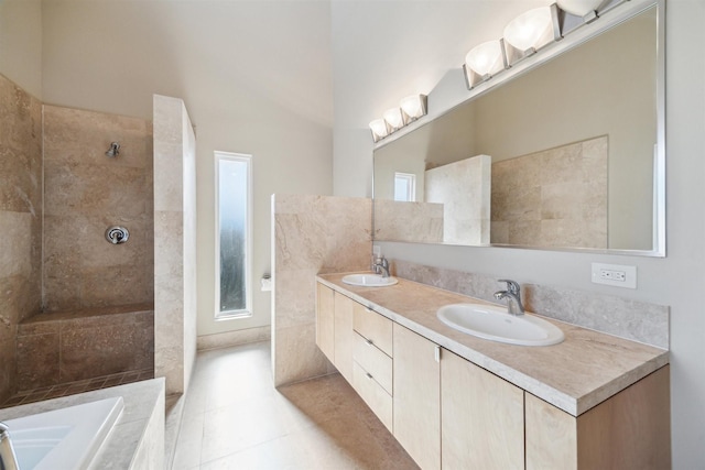 bathroom with tile patterned flooring, vanity, and independent shower and bath