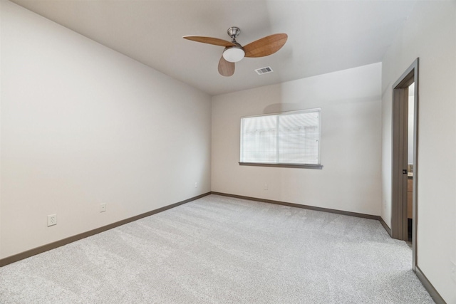 carpeted empty room featuring ceiling fan