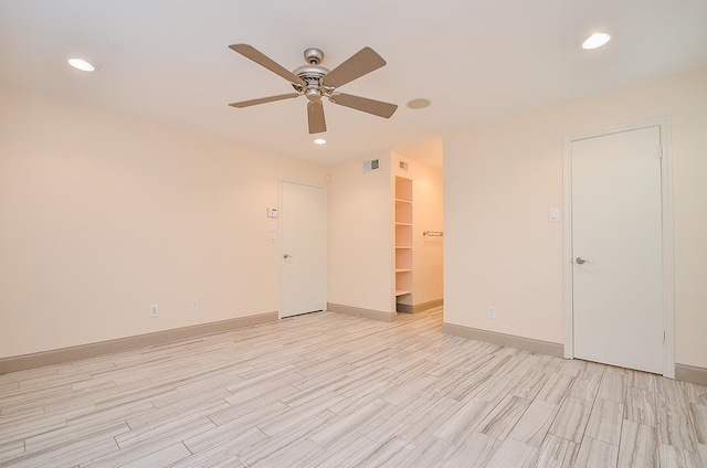 unfurnished room with light hardwood / wood-style floors and ceiling fan