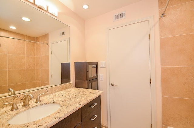 bathroom featuring vanity and walk in shower