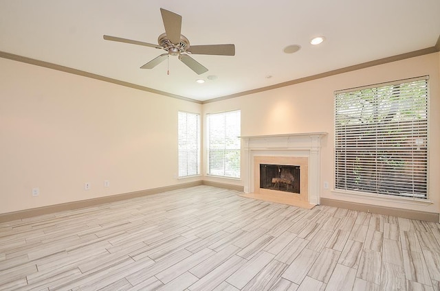 unfurnished living room featuring crown molding, light hardwood / wood-style flooring, and ceiling fan