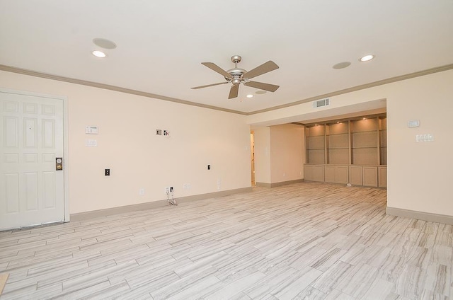 spare room with ceiling fan, light wood-type flooring, and crown molding