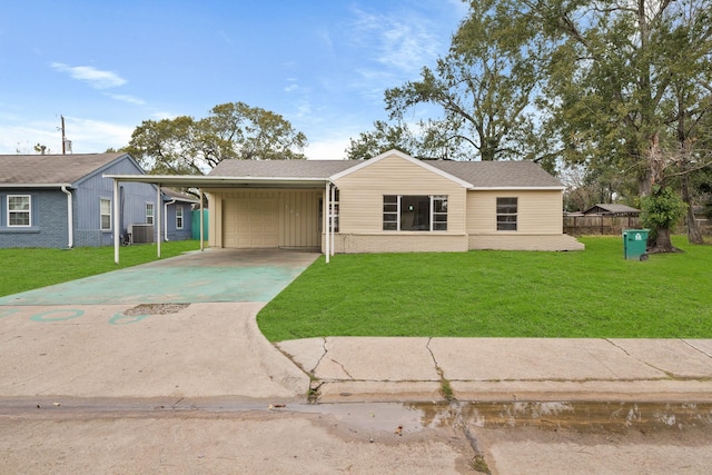 single story home with central AC, a front lawn, a garage, and a carport