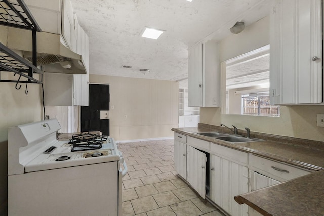 kitchen with white cabinetry, white gas stove, and sink