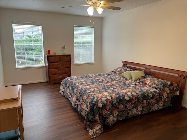 bedroom featuring ceiling fan and dark hardwood / wood-style floors