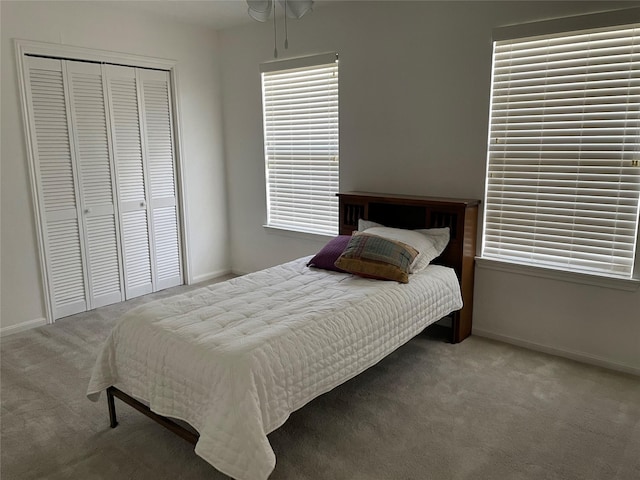 bedroom with carpet and a closet