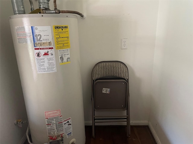 utility room featuring water heater