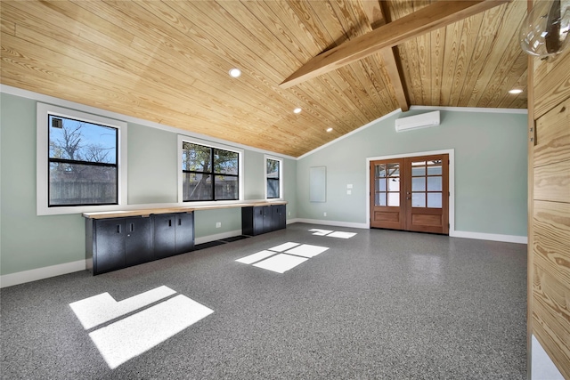 unfurnished living room featuring lofted ceiling with beams, a wealth of natural light, and wooden ceiling