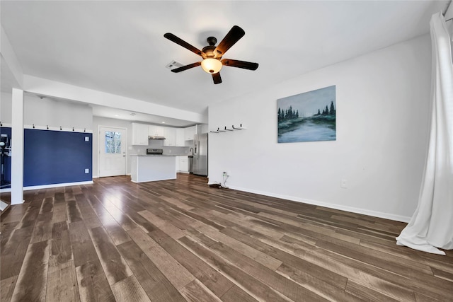 unfurnished living room featuring dark hardwood / wood-style floors and ceiling fan