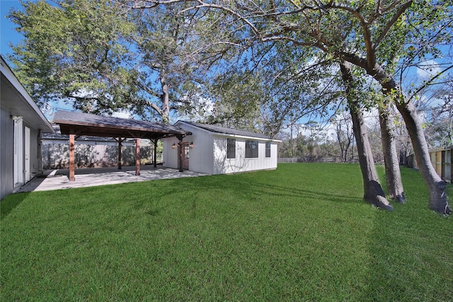 view of yard featuring an outbuilding and a patio