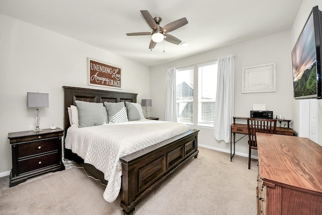 bedroom featuring ceiling fan and light carpet