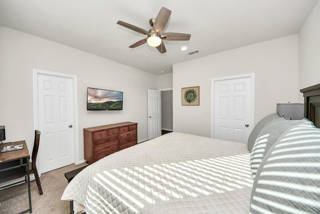 carpeted bedroom featuring a closet and ceiling fan