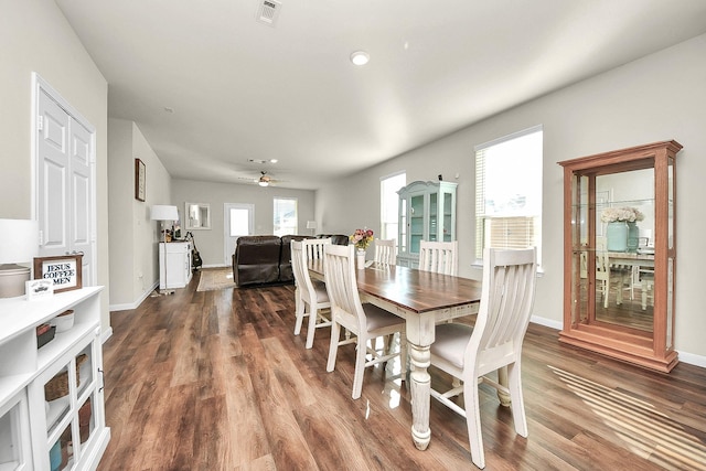 dining room with hardwood / wood-style floors and ceiling fan